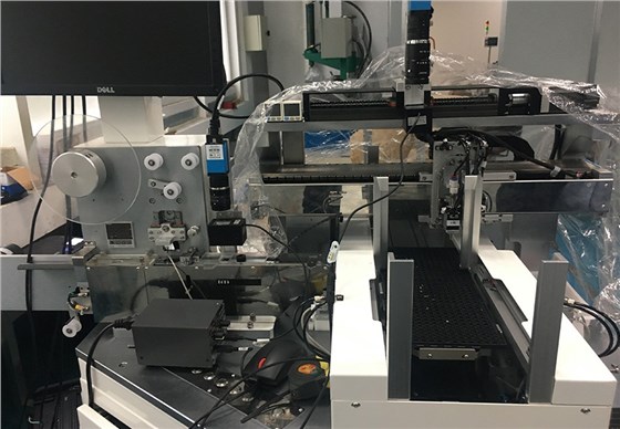 Electronic component inspection and packaging machine